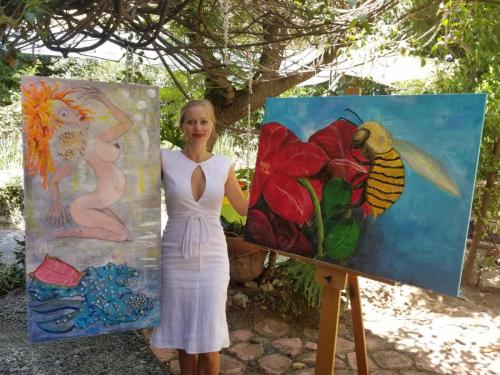 Katarzyna with 2 of her acrylic paintings