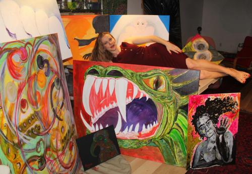 Katarzyna with a few of her paintings